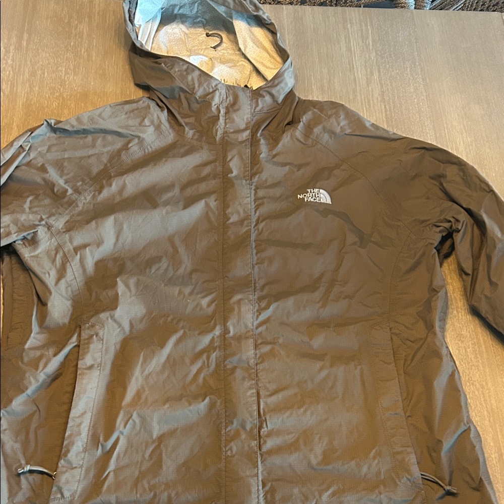 The North Face woman’s tan Raincoat‎